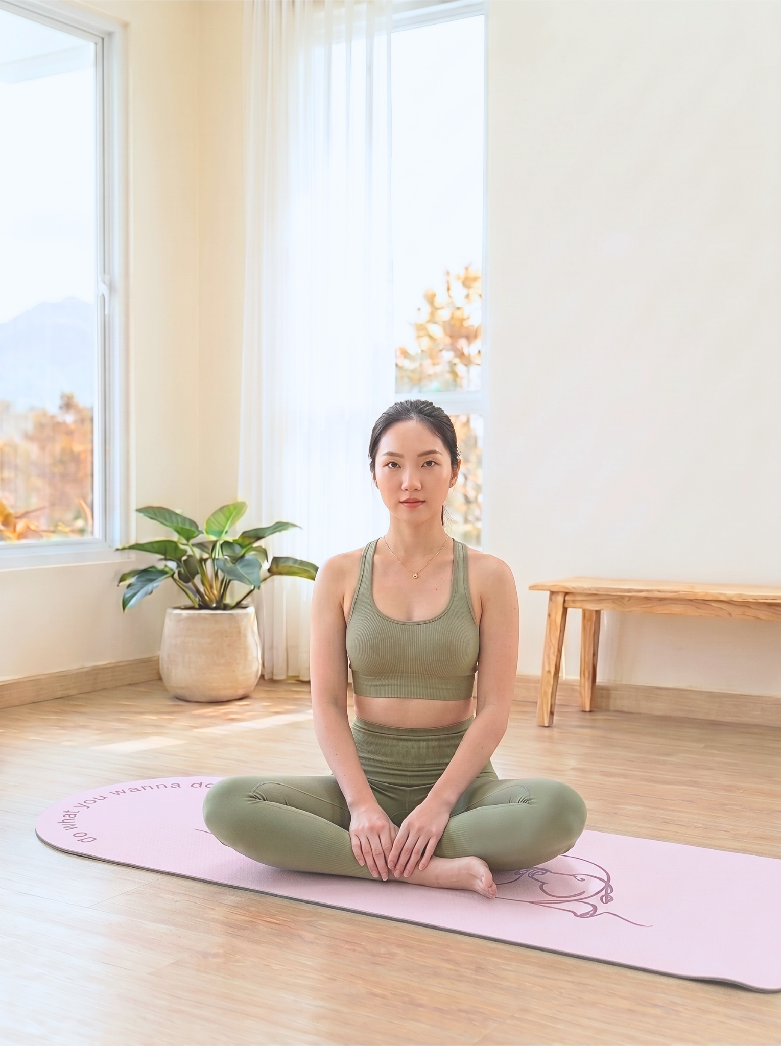 Seated on a Lazy Hippo mat in a bright studio